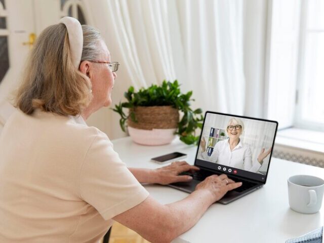 A patient on a video call with her care provider from home
